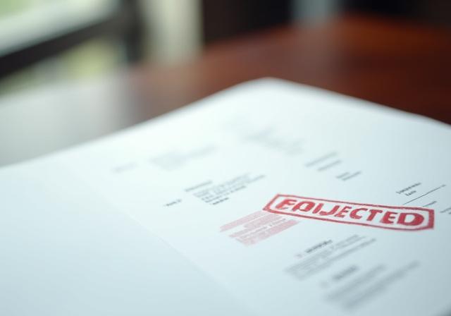 Close up of a generic legal document with a red rejection stamp